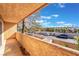 Cozy balcony overlooking the street with a serene view of mature trees and clear blue skies on a sunny day at 2851 S Valley View Blvd # 2148, Las Vegas, NV 89102