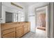 Bathroom featuring a vanity, large mirror, tile floor, and shower with pink shower curtain at 2851 S Valley View Blvd # 2148, Las Vegas, NV 89102