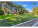 Inviting community green space furnished with comfortable seating, surrounded by mature trees and lush greenery at 2851 S Valley View Blvd # 2148, Las Vegas, NV 89102