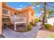 Charming two-story condo with landscaped front yard and walkway under a sunny blue sky at 2851 S Valley View Blvd # 2148, Las Vegas, NV 89102