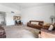 Open concept featuring neutral carpet, two couches, and a dining table for modern comfort and functionality at 2851 S Valley View Blvd # 2148, Las Vegas, NV 89102