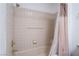Neutral-toned shower-tub with shower curtain and tile walls at 2851 S Valley View Blvd # 2148, Las Vegas, NV 89102