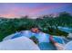 Aerial view of backyard oasis, featuring a custom pool, rock waterfall, spa, and beautiful landscaping at 2940 Cimini Ct, Henderson, NV 89052