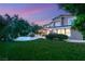 Spacious backyard with a custom pool, covered patio, and lush greenery, ideal for entertaining at 2940 Cimini Ct, Henderson, NV 89052