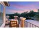 Relaxing balcony featuring outdoor seating and picturesque views of the surrounding landscape at sunset at 2940 Cimini Ct, Henderson, NV 89052