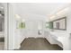 Bright bathroom featuring dual vanities, modern lighting, and wood-look tile flooring at 2940 Cimini Ct, Henderson, NV 89052