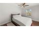 Bright bedroom featuring a ceiling fan, hardwood floors, and neutral walls, creating a serene atmosphere at 2940 Cimini Ct, Henderson, NV 89052
