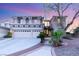 Charming two-story home featuring a three-car garage, landscaped yard, and inviting walkway at 2940 Cimini Ct, Henderson, NV 89052