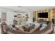 Spacious open floor plan connecting the living room with the kitchen and showcasing marble floors at 2940 Cimini Ct, Henderson, NV 89052