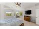 Comfortable main bedroom with large windows and a ceiling fan, perfect for relaxation at 2940 Cimini Ct, Henderson, NV 89052