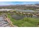 Breathtaking aerial shot of the community's tranquil lake and beautiful green golf course at 30 Via Vasari # 102, Henderson, NV 89011