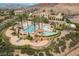 Aerial view of the community pool area, showcasing the pool, cabanas, and lush landscaping at 30 Via Vasari # 102, Henderson, NV 89011