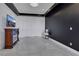 Modern bedroom with marble floors, dark accent wall, and fireplace feature at 30 Via Vasari # 102, Henderson, NV 89011