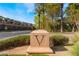 Elegant community entrance with a distinctive 'V' monument, beautiful landscaping, and a welcoming atmosphere at 30 Via Vasari # 102, Henderson, NV 89011