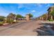 View of the community gate and entrance featuring brick-paved roads and landscaped surroundings at 30 Via Vasari # 102, Henderson, NV 89011