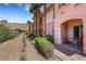 Attractive home exterior with desert landscaping and outdoor seating area at 30 Via Vasari # 102, Henderson, NV 89011