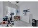 Home gym with exercise equipment, white curtains, and neutral walls at 30 Via Vasari # 102, Henderson, NV 89011