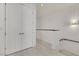Hallway featuring marble tile flooring, double closets, and contemporary fixtures at 30 Via Vasari # 102, Henderson, NV 89011