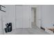 Hallway featuring tile floors, access to many rooms, and neutral walls at 30 Via Vasari # 102, Henderson, NV 89011