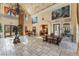 The grand lobby boasts high ceilings, tile floors, statement art, and offers views into the kitchen and dining areas at 30 Via Vasari # 102, Henderson, NV 89011