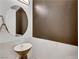 Contemporary powder room featuring a unique vessel sink and a round mirror at 30 Via Vasari # 102, Henderson, NV 89011