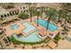 Luxury pools surrounded by lush landscaping and comfortable cabanas for ultimate relaxation at 30 Via Vasari # 102, Henderson, NV 89011