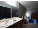 Comfortable bedroom boasts accent wall and complementary furnishings at 3008 Saint George St # B, North Las Vegas, NV 89030
