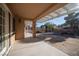 Inviting covered back patio with string lights and landscaped yard at 3105 Birch Hill Ct, Las Vegas, NV 89134