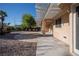 Exterior shot showcasing covered patio with stone patio surrounded by desert landscaping at 3105 Birch Hill Ct, Las Vegas, NV 89134