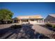Backyard view of a single-story home with tile roof and covered patio at 3105 Birch Hill Ct, Las Vegas, NV 89134