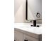 Bathroom sink and faucet features a rectangular frameless mirror and white quartz counter at 3105 Birch Hill Ct, Las Vegas, NV 89134