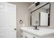 Modern bathroom features a framed mirror, white vanity, and upgraded hardware at 3105 Birch Hill Ct, Las Vegas, NV 89134