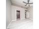 Bedroom features whitewashed floors, ceiling fan, and access to closet and bathroom at 3105 Birch Hill Ct, Las Vegas, NV 89134