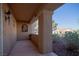 Exterior view of the covered entryway with desert landscaping and neighborhood view at 3105 Birch Hill Ct, Las Vegas, NV 89134