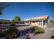 Backyard view of a single-story home with tile roof and covered patio at 3105 Birch Hill Ct, Las Vegas, NV 89134