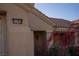 Close up of the address over the home's entryway, enhanced by vibrant shrubs and a tile roof at 3105 Birch Hill Ct, Las Vegas, NV 89134