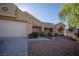 Single-story home featuring desert landscaping, a tile roof, and a two-car garage with an extended driveway at 3105 Birch Hill Ct, Las Vegas, NV 89134