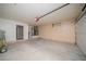Spacious garage with white door and neutral colored storage cabinets along the back wall at 3105 Birch Hill Ct, Las Vegas, NV 89134
