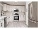Spacious kitchen with stainless-steel appliances, white cabinetry, and ample countertop space at 3105 Birch Hill Ct, Las Vegas, NV 89134