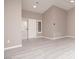 Bright living room boasts light gray flooring, neutral walls, and a sliding glass door at 3105 Birch Hill Ct, Las Vegas, NV 89134
