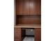 Built in office desk and cabinets in wood finish with a view of light grey flooring at 3105 Birch Hill Ct, Las Vegas, NV 89134