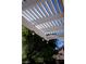 View of a pergola featuring white wooden beams and string lights at 3105 Birch Hill Ct, Las Vegas, NV 89134