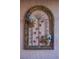 Close up of the entryway's decorative wall art with foliage at 3105 Birch Hill Ct, Las Vegas, NV 89134