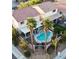 An aerial shot of a home with a pool, palm trees, and a community sign in a residential neighborhood at 3194 Lapis Beach Dr, Las Vegas, NV 89117