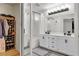 White bathroom with bath and shower, with dual sinks and a mirror at 3194 Lapis Beach Dr, Las Vegas, NV 89117