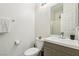 Bright bathroom featuring a modern sink vanity, toilet and shower with glass door at 3194 Lapis Beach Dr, Las Vegas, NV 89117