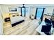 Spacious bedroom with a bed, office setup, ceiling fan, and ample natural light at 3194 Lapis Beach Dr, Las Vegas, NV 89117