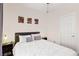 Bedroom featuring a plush queen bed, stylish decor, and plenty of natural light at 3194 Lapis Beach Dr, Las Vegas, NV 89117