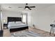 Bedroom featuring a king bed, modern furnishings, and natural light at 3194 Lapis Beach Dr, Las Vegas, NV 89117