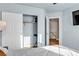 Bedroom featuring a closet, modern TV, and access to the stairs at 3194 Lapis Beach Dr, Las Vegas, NV 89117
